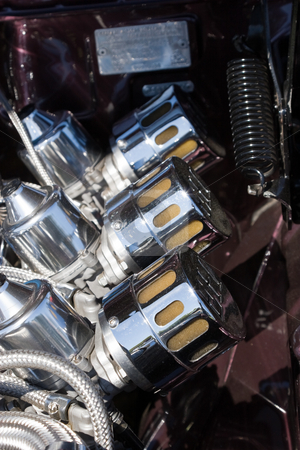 To use this stock image in your creative project, please select the size you need over to the right and click the "Add to Cart" button.
Your downloaded image will come with the Cutcaster watermark removed so don’t worry about the watermark you see on this page. Carburettors stock photo, Engines chromed carburettors by Nicholas Rjabow