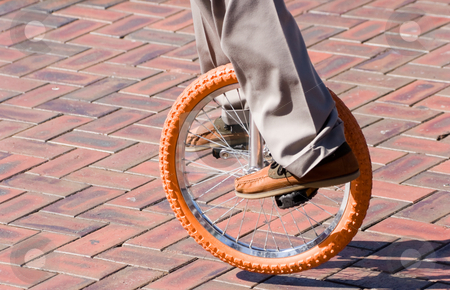 To use this stock image in your creative project, please select the size you need over to the right and click the "Add to Cart" button.
Your downloaded image will come with the Cutcaster watermark removed so don’t worry about the watermark you see on this page. Unicycle stock photo, A unicycle being ridden by Nicholas Rjabow