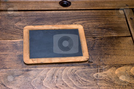 To use this stock image in your creative project, please select the size you need over to the right and click the "Add to Cart" button.
Your downloaded image will come with the Cutcaster watermark removed so don’t worry about the watermark you see on this page. Ols School Days stock photo, Antique desk chalk-board on period desk by Paul Phillips