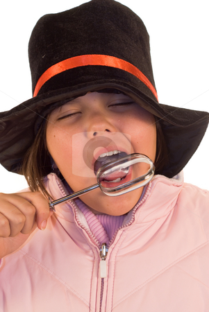 To use this stock image in your creative project, please select the size you need over to the right and click the "Add to Cart" button.
Your downloaded image will come with the Cutcaster watermark removed so don’t worry about the watermark you see on this page. Winter Treat stock photo, A youn girl licking a beater, while wearing winter clothes by Richard Nelson