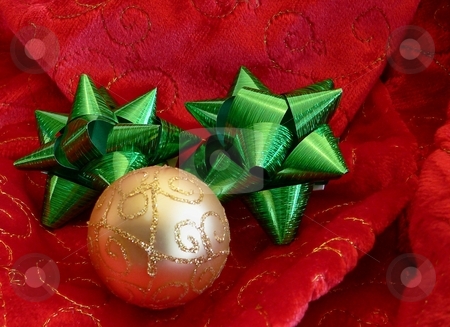 To use this stock image in your creative project, please select the size you need over to the right and click the "Add to Cart" button.
Your downloaded image will come with the Cutcaster watermark removed so don’t worry about the watermark you see on this page. Christmas stock photo, Christmas design with red and gold on velvety fabric by Perry Correll