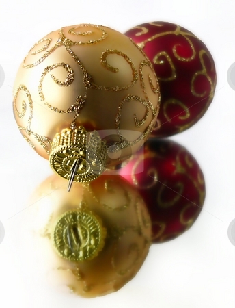 To use this stock image in your creative project, please select the size you need over to the right and click the "Add to Cart" button.
Your downloaded image will come with the Cutcaster watermark removed so don’t worry about the watermark you see on this page. Christmas Ornaments stock photo, Gold and Red Christmas ornaments sitting on mirror by Perry Correll