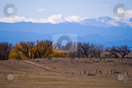 To use this stock image in your creative project, please select the size you need over to the right and click the "Add to Cart" button.
Your downloaded image will come with the Cutcaster watermark removed so don’t worry about the watermark you see on this page. Clouds forming over the Colorado Rockies stock photo, An autumn scene looking west towards the Rock Mountains. by RCarner Photography