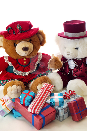 To use this stock image in your creative project, please select the size you need over to the right and click the "Add to Cart" button.
Your downloaded image will come with the Cutcaster watermark removed so don’t worry about the watermark you see on this page. Teddy bear Christmas stock photo, Two teddy bears exchange gifts for Christmas by RCarner Photography