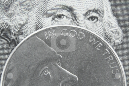 To use this stock image in your creative project, please select the size you need over to the right and click the "Add to Cart" button.
Your downloaded image will come with the Cutcaster watermark removed so don’t worry about the watermark you see on this page. In God We Trust stock photo, George Washington behind Jefferson nickel. by Todd Dixon