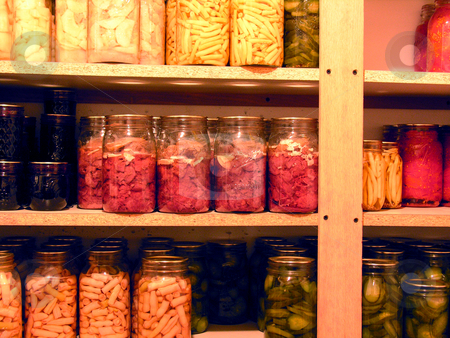 To use this stock image in your creative project, please select the size you need over to the right and click the "Add to Cart" button.
Your downloaded image will come with the Cutcaster watermark removed so don’t worry about the watermark you see on this page. Canned Foods stock photo, Shelves of home canned food in jars by Jaime Wykle
