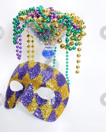 To use this stock image in your creative project, please select the size you need over to the right and click the "Add to Cart" button.
Your downloaded image will come with the Cutcaster watermark removed so don’t worry about the watermark you see on this page. Mardis Gras stock photo, Mardis gras image of beads and harlequin mask by Perry Correll