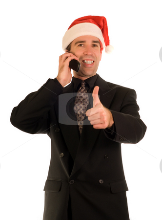 To use this stock image in your creative project, please select the size you need over to the right and click the "Add to Cart" button.
Your downloaded image will come with the Cutcaster watermark removed so don’t worry about the watermark you see on this page. Xmas Thumbs Up stock photo, Businessman giving the thumbs up sign while talking on a cell phone by Richard Nelson