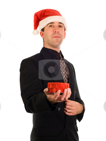 To use this stock image in your creative project, please select the size you need over to the right and click the "Add to Cart" button.
Your downloaded image will come with the Cutcaster watermark removed so don’t worry about the watermark you see on this page. Christmas Gift stock photo, A young businessman holding a Christmas gift by Richard Nelson