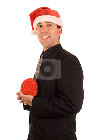 To use this stock image in your creative project, please select the size you need over to the right and click the "Add to Cart" button.
Your downloaded image will come with the Cutcaster watermark removed so don’t worry about the watermark you see on this page. Businessman Present stock photo, A young businessman holding his present from Christmas by Richard Nelson