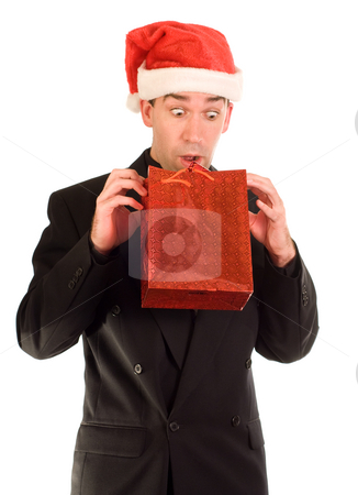 To use this stock image in your creative project, please select the size you need over to the right and click the "Add to Cart" button.
Your downloaded image will come with the Cutcaster watermark removed so don’t worry about the watermark you see on this page. Early Peek stock photo, A businessman looking at his gift before Christmas by Richard Nelson