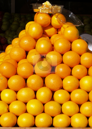 To use this stock image in your creative project, please select the size you need over to the right and click the "Add to Cart" button.
Your downloaded image will come with the Cutcaster watermark removed so don’t worry about the watermark you see on this page. Pyramid of oranges in store front display stock photo, Oranges stacked in display outside of store by Jeff Cleveland