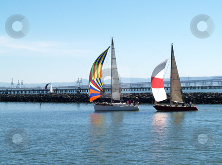 To use this stock image in your creative project, please select the size you need over to the right and click the "Add to Cart" button.
Your downloaded image will come with the Cutcaster watermark removed so don’t worry about the watermark you see on this page. Two Sailboats under Spinnakers running into port stock photo, Sailboats under spinnaker sails running into the marina by Jeff Cleveland