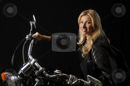 To use this stock image in your creative project, please select the size you need over to the right and click the "Add to Cart" button.
Your downloaded image will come with the Cutcaster watermark removed so don’t worry about the watermark you see on this page. Woman on a Motorcycle stock photo, Woman enjoying her motorcycle by Timothy OLeary