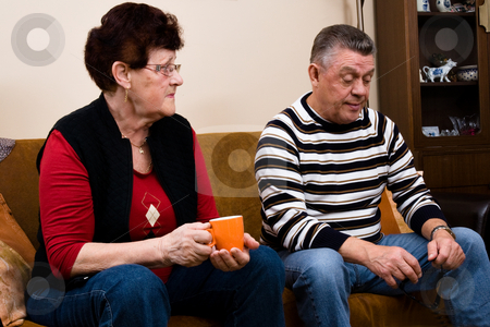 To use this stock image in your creative project, please select the size you need over to the right and click the "Add to Cart" button.
Your downloaded image will come with the Cutcaster watermark removed so don’t worry about the watermark you see on this page. Senior couple drinking cofee in the livingroom stock photo, Elderly couple relaxing on the couch by Frenk and Danielle Kaufmann