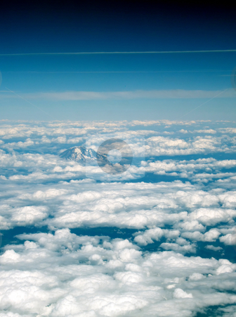 To use this stock image in your creative project, please select the size you need over to the right and click the "Add to Cart" button.
Your downloaded image will come with the Cutcaster watermark removed so don’t worry about the watermark you see on this page. Arial View Mount Top in clouds blue sky stock photo, Arial View of Mount Top surrounded by Clouds and blue sky by Jeff Cleveland