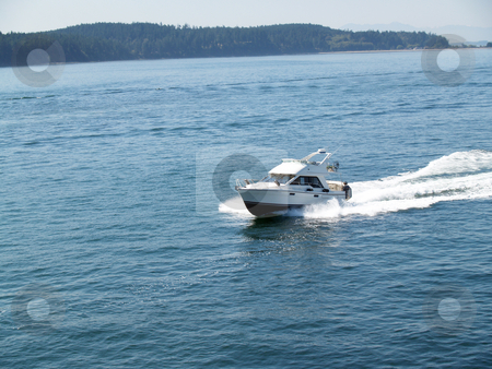 To use this stock image in your creative project, please select the size you need over to the right and click the "Add to Cart" button.
Your downloaded image will come with the Cutcaster watermark removed so don’t worry about the watermark you see on this page. Cabin Motor Boat Underway speeding with wake stock photo, Motor Boat under speed on bay with wake by Jeff Cleveland
