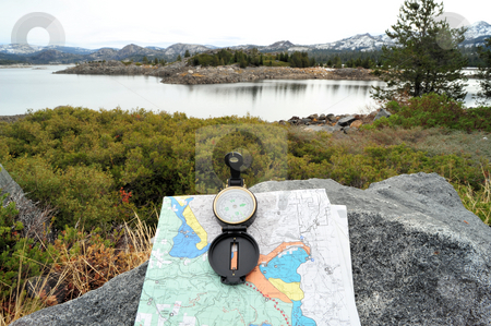 To use this stock image in your creative project, please select the size you need over to the right and click the "Add to Cart" button.
Your downloaded image will come with the Cutcaster watermark removed so don’t worry about the watermark you see on this page. Compass, Map And Lake stock photo, A hiking map and compass overlooking a lake in the Califirnia sierra nevada mountains. by Lynn Bendickson