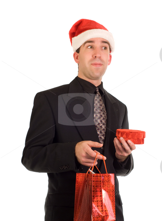 To use this stock image in your creative project, please select the size you need over to the right and click the "Add to Cart" button.
Your downloaded image will come with the Cutcaster watermark removed so don’t worry about the watermark you see on this page. Corporate Xmas Gift stock photo, A young businessman holding a couple of Christmas gifts by Richard Nelson