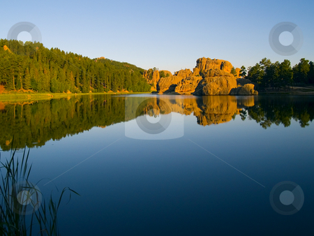 To use this stock image in your creative project, please select the size you need over to the right and click the "Add to Cart" button.
Your downloaded image will come with the Cutcaster watermark removed so don’t worry about the watermark you see on this page. Sylvan Lake Shore stock photo, Early morning from the shore of Sylvan Lake in the Black Hills of South Dakota by John McLaird