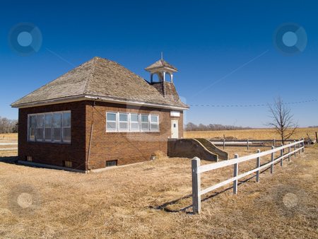 To use this stock image in your creative project, please select the size you need over to the right and click the "Add to Cart" button.
Your downloaded image will come with the Cutcaster watermark removed so don’t worry about the watermark you see on this page. One Room School Under Blue Sky stock photo, An old one room school house on the vast Nebraska prairie by John McLaird