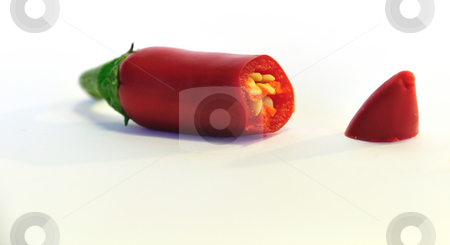 To use this stock image in your creative project, please select the size you need over to the right and click the "Add to Cart" button.
Your downloaded image will come with the Cutcaster watermark removed so don’t worry about the watermark you see on this page. Cut chili stock photo, A red chili cut open by Per W?