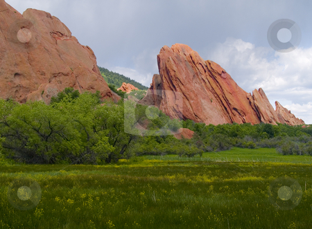 To use this stock image in your creative project, please select the size you need over to the right and click the "Add to Cart" button.
Your downloaded image will come with the Cutcaster watermark removed so don’t worry about the watermark you see on this page. Red Rocks in Bloom stock photo, Red rocks and a blooming meadow as spring covers Roxborough State Park, Colorado by John McLaird