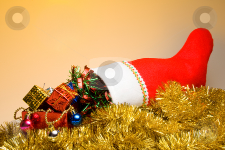 To use this stock image in your creative project, please select the size you need over to the right and click the "Add to Cart" button.
Your downloaded image will come with the Cutcaster watermark removed so don’t worry about the watermark you see on this page. Christmas Stocking stock photo, A Christmas stocking filled with holiday goodies. by Robert Byron