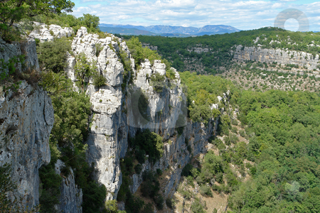 To use this stock image in your creative project, please select the size you need over to the right and click the "Add to Cart" button.
Your downloaded image will come with the Cutcaster watermark removed so don’t worry about the watermark you see on this page. Rocky Cliffs in Chassezac, Ardeche Valley, Southern France stock photo, Im Tal des Chassezac (Ardeche) S?dfrankreich by Wolfgang Heidasch