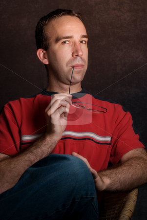 To use this stock image in your creative project, please select the size you need over to the right and click the "Add to Cart" button.
Your downloaded image will come with the Cutcaster watermark removed so don’t worry about the watermark you see on this page. Sophisticated Male stock photo, A young sophisticated looking male wearing casual clothing by Richard Nelson