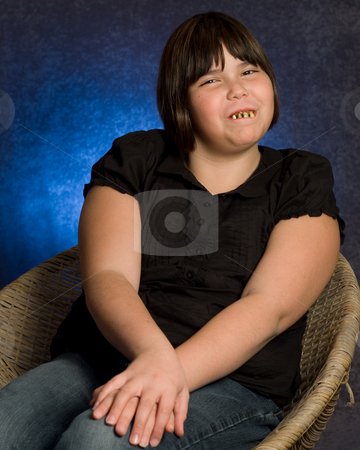 To use this stock image in your creative project, please select the size you need over to the right and click the "Add to Cart" button.
Your downloaded image will come with the Cutcaster watermark removed so don’t worry about the watermark you see on this page. Adorable Girl stock photo, An adorable looking girl wearing some ugly rotten teeth, while getting her portrait done by Richard Nelson