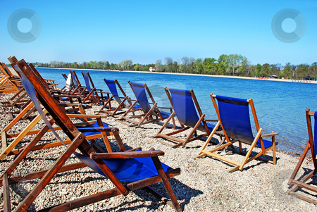 To use this stock image in your creative project, please select the size you need over to the right and click the "Add to Cart" button.
Your downloaded image will come with the Cutcaster watermark removed so don’t worry about the watermark you see on this page. Blue folding chairs stock photo, Row of folding chairs by on beach by blue water by Julija Sapic