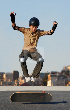 To use this stock image in your creative project, please select the size you need over to the right and click the "Add to Cart" button.
Your downloaded image will come with the Cutcaster watermark removed so don’t worry about the watermark you see on this page. Boy Jumping from Skateboard stock photo, Boy jumping from skateboard wearing protective gear by Denis Radovanovic