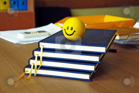 To use this stock image in your creative project, please select the size you need over to the right and click the "Add to Cart" button.
Your downloaded image will come with the Cutcaster watermark removed so don’t worry about the watermark you see on this page. New plans stock photo, New blue organizers and yellow smiley ball on office desk by Julija Sapic