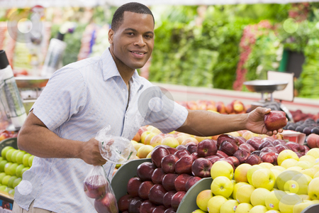 To use this stock image in your creative project, please select the size you need over to the right and click the "Add to Cart" button.
Your downloaded image will come with the Cutcaster watermark removed so don’t worry about the watermark you see on this page. Man shopping in produce section stock photo, Man shopping in produce section of supermarket by Monkey Business Images