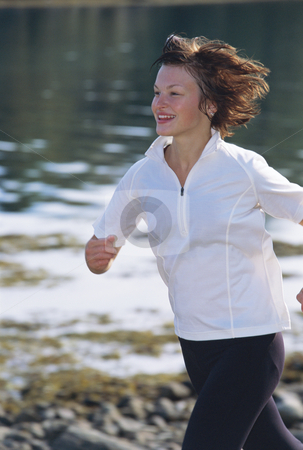 To use this stock image in your creative project, please select the size you need over to the right and click the "Add to Cart" button.
Your downloaded image will come with the Cutcaster watermark removed so don’t worry about the watermark you see on this page. Young woman running along water's edge stock photo, by Monkey Business Images