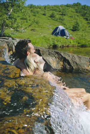 To use this stock image in your creative project, please select the size you need over to the right and click the "Add to Cart" button.
Your downloaded image will come with the Cutcaster watermark removed so don’t worry about the watermark you see on this page. Couple sitting in running water on lakes edge stock photo, by Monkey Business Images