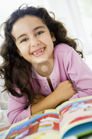To use this stock image in your creative project, please select the size you need over to the right and click the "Add to Cart" button.
Your downloaded image will come with the Cutcaster watermark removed so don’t worry about the watermark you see on this page. A Middle Eastern girl reading a book stock photo, by Monkey Business Images