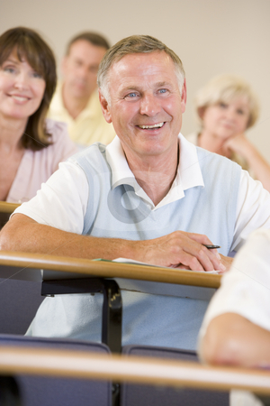 To use this stock image in your creative project, please select the size you need over to the right and click the "Add to Cart" button.
Your downloaded image will come with the Cutcaster watermark removed so don’t worry about the watermark you see on this page. Senior man listening to a university lecture stock photo, by Monkey Business Images