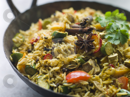 To use this stock image in your creative project, please select the size you need over to the right and click the "Add to Cart" button.
Your downloaded image will come with the Cutcaster watermark removed so don’t worry about the watermark you see on this page. Vegetable Biryani in a Large Karahi stock photo, Vegetable Biryani in a Large Karahi pan by Monkey Business Images