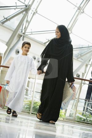 To use this stock image in your creative project, please select the size you need over to the right and click the "Add to Cart" button.
Your downloaded image will come with the Cutcaster watermark removed so don’t worry about the watermark you see on this page. A Middle Eastern woman and her son in a shopping mall stock photo, by Monkey Business Images