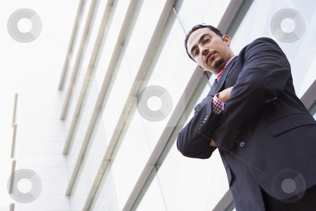 To use this stock image in your creative project, please select the size you need over to the right and click the "Add to Cart" button.
Your downloaded image will come with the Cutcaster watermark removed so don’t worry about the watermark you see on this page. Businessman standing outside office block stock photo, Businessman standing outside office block looking to camera by Monkey Business Images