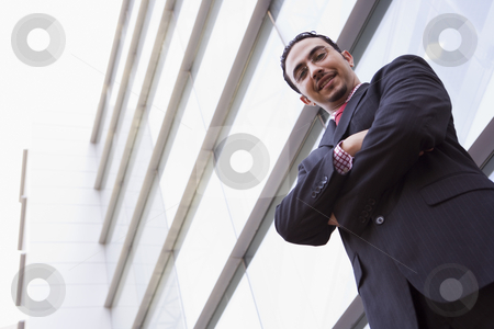 To use this stock image in your creative project, please select the size you need over to the right and click the "Add to Cart" button.
Your downloaded image will come with the Cutcaster watermark removed so don’t worry about the watermark you see on this page. Businessman standing outside office building stock photo, Businessman standing outside office building looking to camera by Monkey Business Images