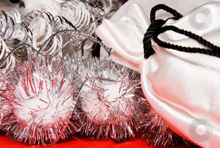 To use this stock image in your creative project, please select the size you need over to the right and click the "Add to Cart" button.
Your downloaded image will come with the Cutcaster watermark removed so don’t worry about the watermark you see on this page. Xmas decoration with gift bag stock photo, Xmas decoration with gift bag on a red cloth by Karin Claus