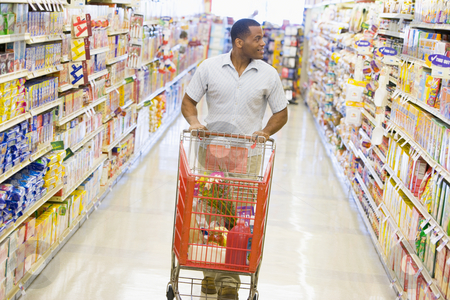 To use this stock image in your creative project, please select the size you need over to the right and click the "Add to Cart" button.
Your downloaded image will come with the Cutcaster watermark removed so don’t worry about the watermark you see on this page. Man pushing trolley along supermarket aisle stock photo, Man pushing trolley along supermarket grocery aisle by Monkey Business Images