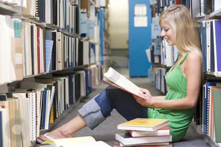 To use this stock image in your creative project, please select the size you need over to the right and click the "Add to Cart" button.
Your downloaded image will come with the Cutcaster watermark removed so don’t worry about the watermark you see on this page. University student working in library stock photo, Female student sitting on library floor surrounded by books by Monkey Business Images