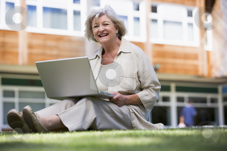 To use this stock image in your creative project, please select the size you need over to the right and click the "Add to Cart" button.
Your downloaded image will come with the Cutcaster watermark removed so don’t worry about the watermark you see on this page. Senior woman using laptop on campus stock photo, by Monkey Business Images