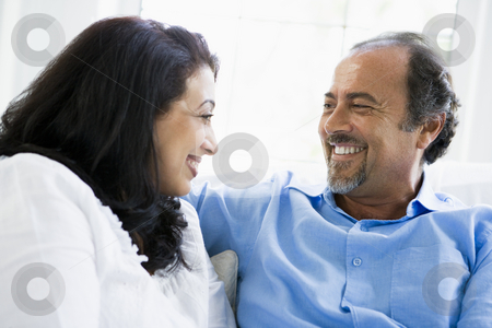 To use this stock image in your creative project, please select the size you need over to the right and click the "Add to Cart" button.
Your downloaded image will come with the Cutcaster watermark removed so don’t worry about the watermark you see on this page. A Middle Eastern couple sitting at home stock photo, by Monkey Business Images
