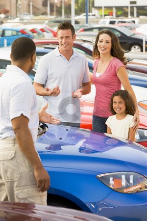 To use this stock image in your creative project, please select the size you need over to the right and click the "Add to Cart" button.
Your downloaded image will come with the Cutcaster watermark removed so don’t worry about the watermark you see on this page. Family discussing new car with salesman stock photo, Family discussing new car with salesman on lot by Monkey Business Images
