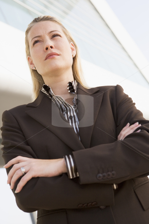To use this stock image in your creative project, please select the size you need over to the right and click the "Add to Cart" button.
Your downloaded image will come with the Cutcaster watermark removed so don’t worry about the watermark you see on this page. Businesswoman standing outdoors by building stock photo, by Monkey Business Images